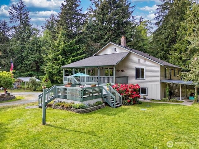 27428 97th Ave SW, Vashon, WA 98070 - view of front of house with a front yard, a chimney, dirt driveway, and roof with shingles