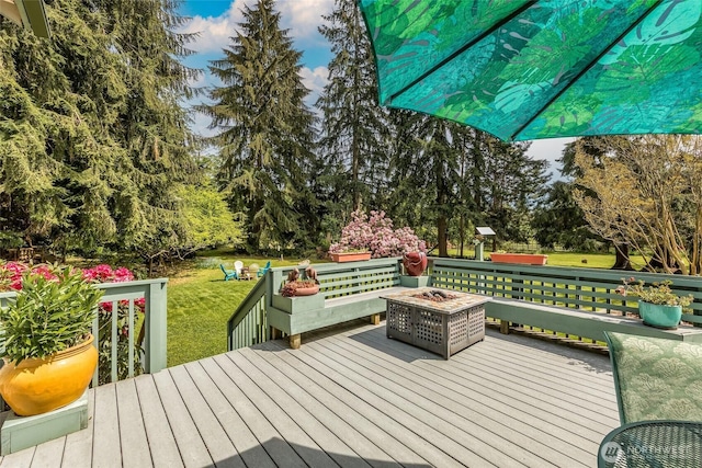 27428 97th Ave SW, Vashon, WA 98070 - deck with a fire pit, a yard, and view of wooded area