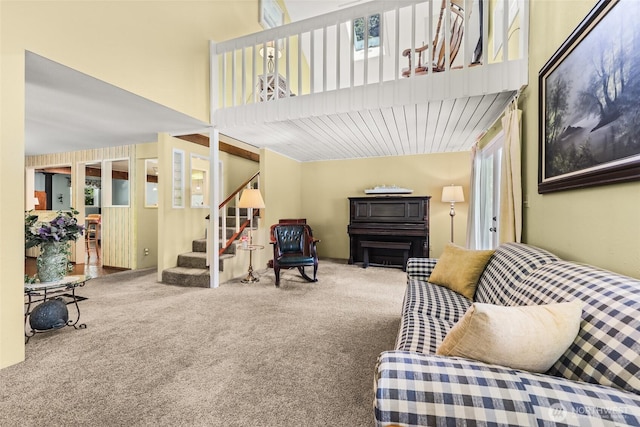 27428 97th Ave SW, Vashon, WA 98070 - living room with carpet floors, stairway, and a towering ceiling