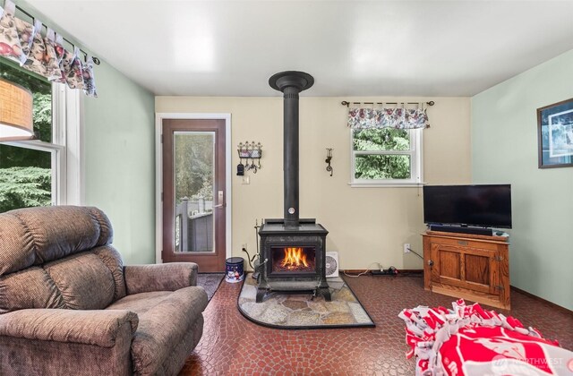 27428 97th Ave SW, Vashon, WA 98070 - living area with a wood stove and plenty of natural light