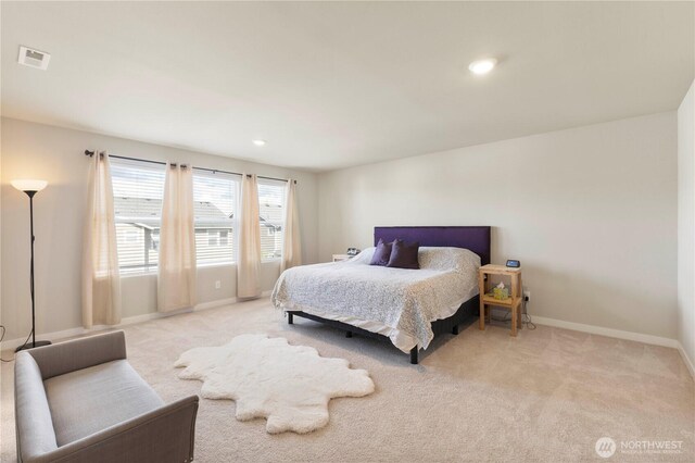 bedroom featuring light colored carpet, baseboards, and recessed lighting