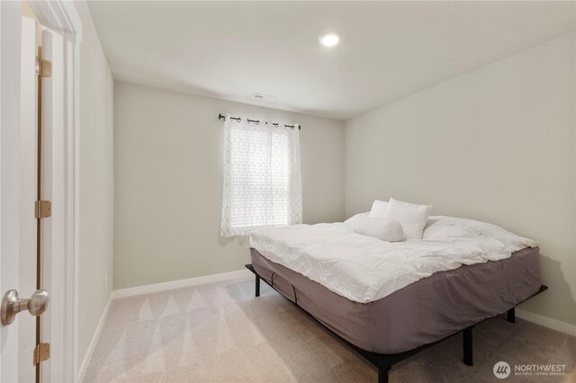 carpeted bedroom with baseboards