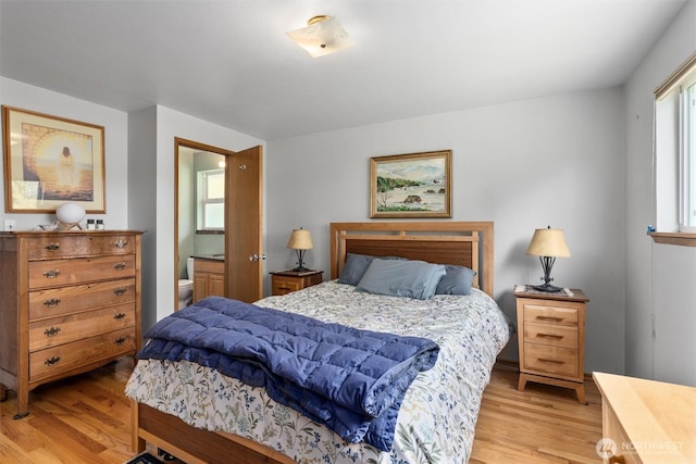 10051 45th Ave NE, Seattle, WA 98125 - bedroom featuring light wood-type flooring and ensuite bathroom