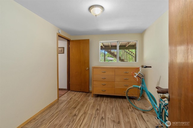 10051 45th Ave NE, Seattle, WA 98125 - bedroom with light wood-type flooring and baseboards