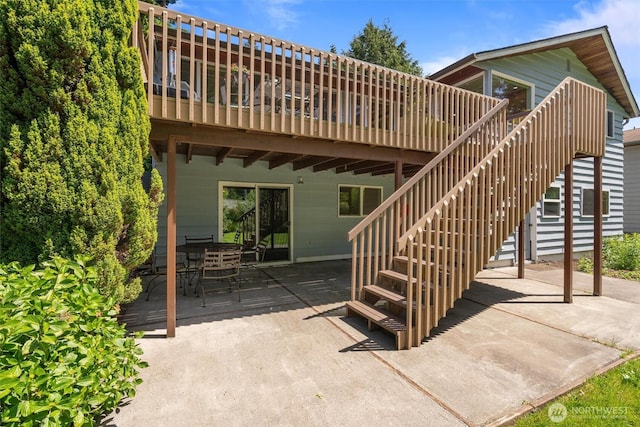 10051 45th Ave NE, Seattle, WA 98125 - view of patio with a wooden deck, outdoor dining area, and stairs