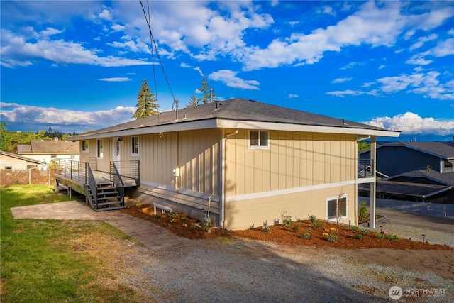 21326 5th Ave S, Des Moines, WA 98198 - view of home's exterior with a lawn and roof with shingles