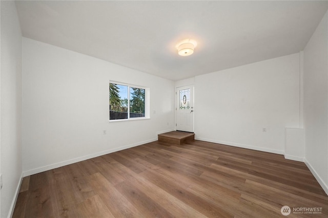 21326 5th Ave S, Des Moines, WA 98198 - empty room with wood finished floors and baseboards