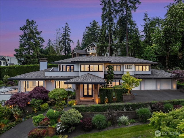 8902 N Mercer Way, Mercer Island, WA 98040 - view of front of house with asphalt driveway and a chimney