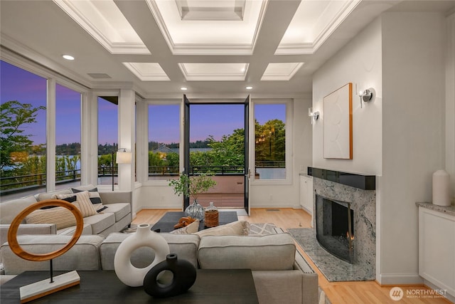 8902 N Mercer Way, Mercer Island, WA 98040 - living room featuring light wood finished floors, a high end fireplace, and healthy amount of natural light