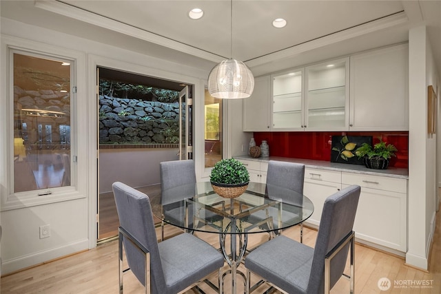 8902 N Mercer Way, Mercer Island, WA 98040 - dining space featuring light wood finished floors, recessed lighting, crown molding, and baseboards
