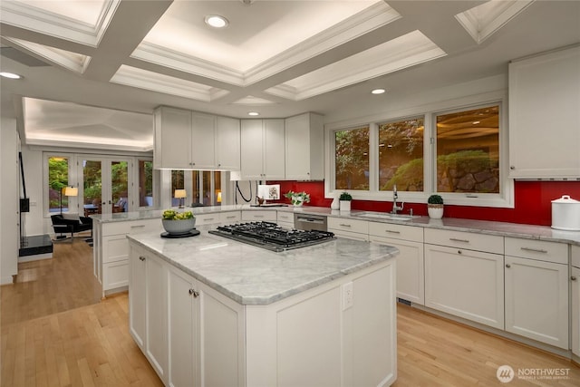 8902 N Mercer Way, Mercer Island, WA 98040 - kitchen featuring stainless steel appliances, a kitchen island, a sink, white cabinets, and light wood-style flooring