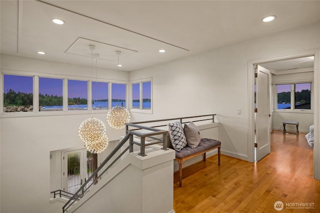 8902 N Mercer Way, Mercer Island, WA 98040 - corridor with an upstairs landing, light wood-type flooring, recessed lighting, a chandelier, and baseboards