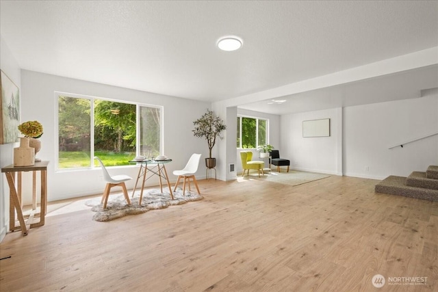 1405 33rd St, Seaview, WA 98644 - living area with light wood finished floors, stairway, and baseboards