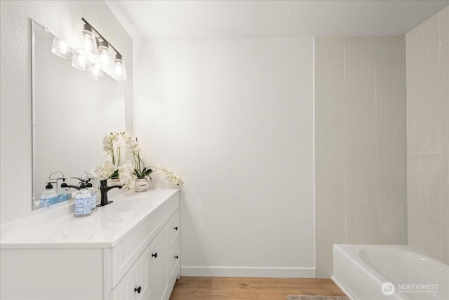 1405 33rd St, Seaview, WA 98644 - bathroom with wood finished floors, vanity, and baseboards
