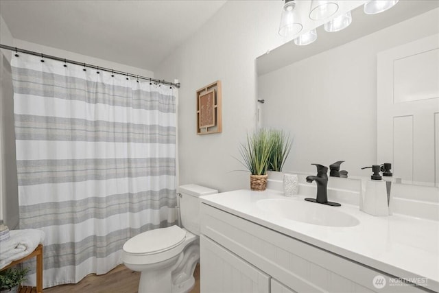 1405 33rd St, Seaview, WA 98644 - full bathroom featuring toilet, vanity, wood finished floors, and curtained shower