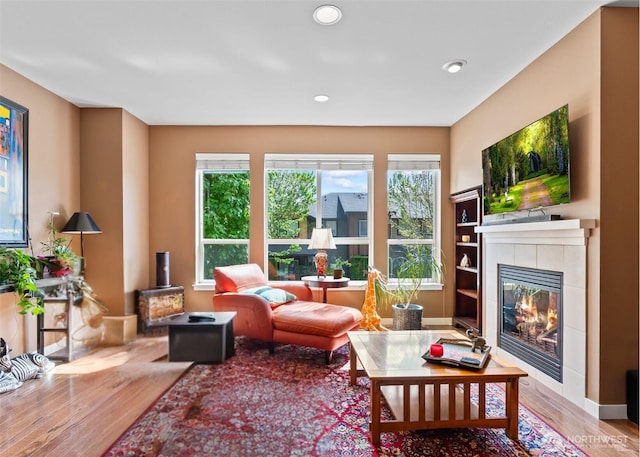 16404 1st Dr SE, Bothell, WA 98012 - living room featuring wood finished floors, a tiled fireplace, and recessed lighting