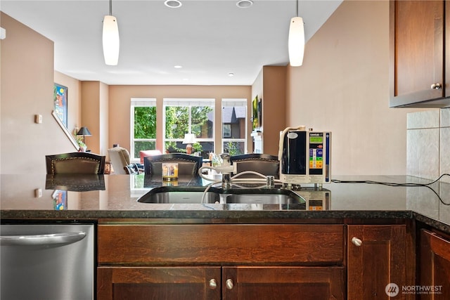 16404 1st Dr SE, Bothell, WA 98012 - kitchen with stainless steel dishwasher, open floor plan, pendant lighting, dark stone countertops, and recessed lighting