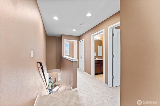 16404 1st Dr SE, Bothell, WA 98012 - hall featuring an upstairs landing, light carpet, baseboards, recessed lighting, and a sink