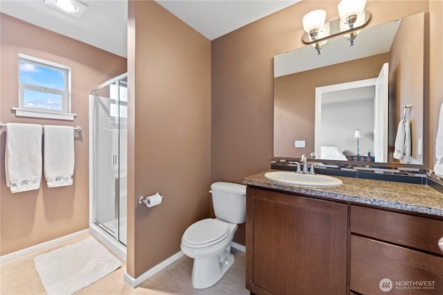16404 1st Dr SE, Bothell, WA 98012 - ensuite bathroom with a shower stall, vanity, toilet, tile patterned floors, and baseboards