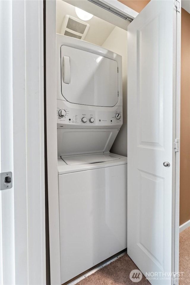 16404 1st Dr SE, Bothell, WA 98012 - laundry area featuring estacked washer and dryer and carpet flooring