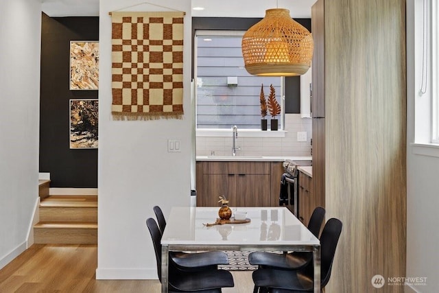 5710 Roosevelt Way NE Unit B, Seattle, WA 98105 - dining space with light wood-style floors and baseboards