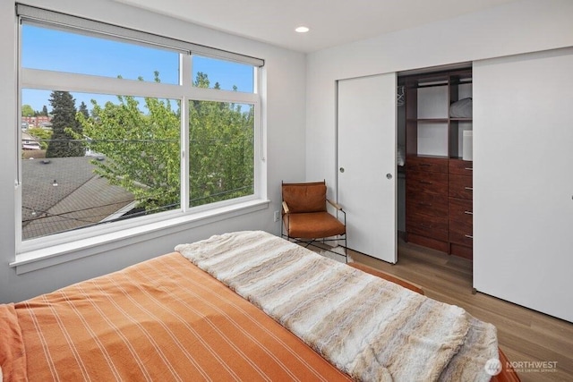 5710 Roosevelt Way NE Unit B, Seattle, WA 98105 - bedroom with wood finished floors, a closet, and recessed lighting