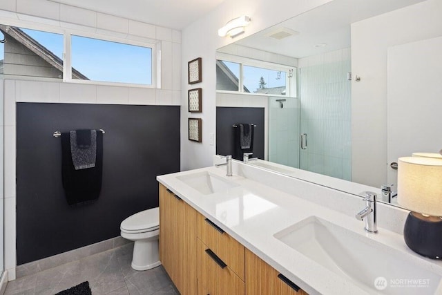 5710 Roosevelt Way NE Unit B, Seattle, WA 98105 - full bathroom featuring toilet, a shower stall, plenty of natural light, and double vanity