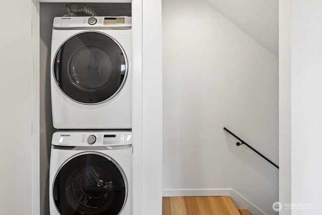 5710 Roosevelt Way NE Unit B, Seattle, WA 98105 - clothes washing area with stacked washer and clothes dryer, wood finished floors, and baseboards
