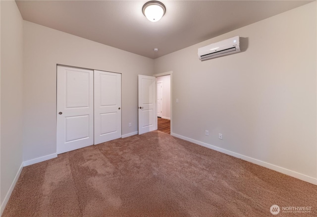 8570 Trillium Ln, Concrete, WA 98237 - unfurnished bedroom with a wall mounted air conditioner, carpet, baseboards, and a closet