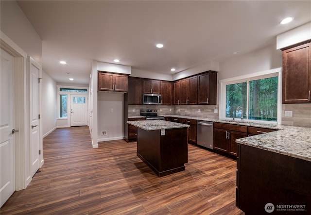 8570 Trillium Ln, Concrete, WA 98237 - kitchen featuring stainless steel appliances, dark wood-style floors, dark brown cabinetry, plenty of natural light, and recessed lighting