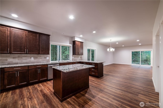 8570 Trillium Ln, Concrete, WA 98237 - kitchen with stainless steel dishwasher, a center island, tasteful backsplash, a peninsula, and a chandelier
