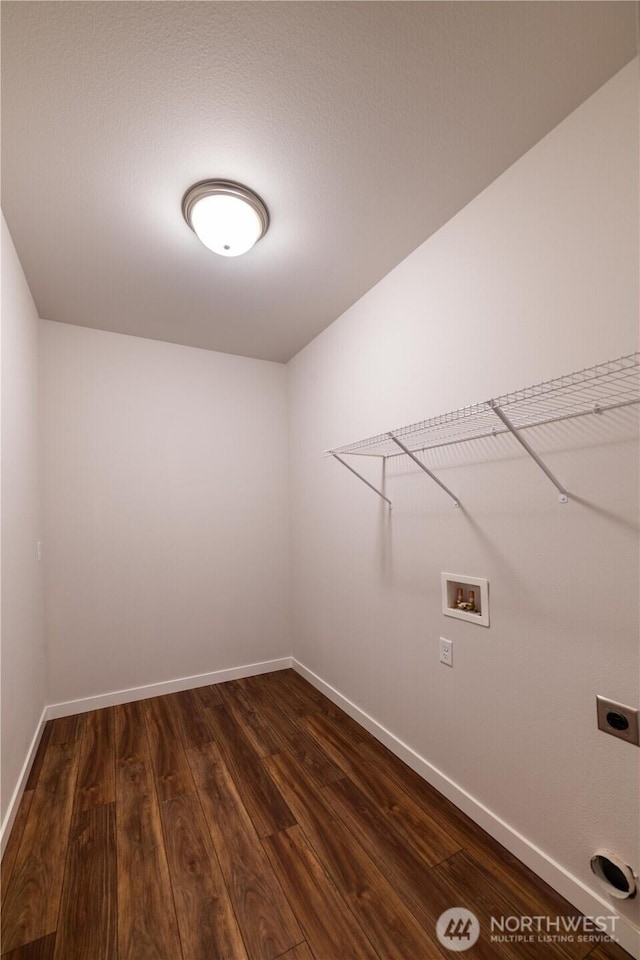 8570 Trillium Ln, Concrete, WA 98237 - washroom featuring hookup for a washing machine, dark wood-style flooring, electric dryer hookup, and baseboards