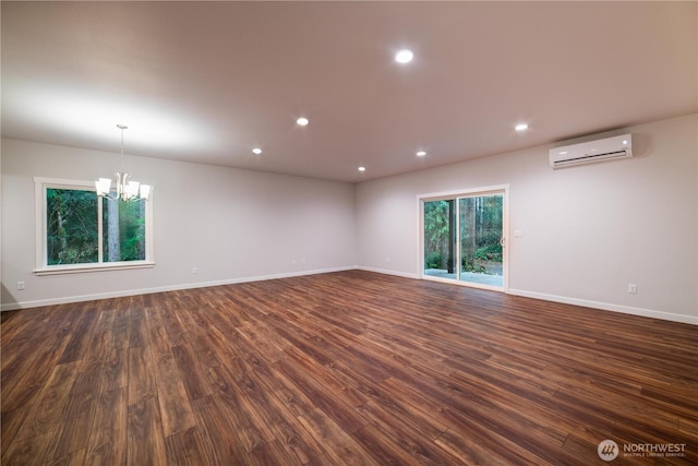 8570 Trillium Ln, Concrete, WA 98237 - unfurnished room featuring a wall mounted air conditioner, a chandelier, dark wood-type flooring, baseboards, and recessed lighting