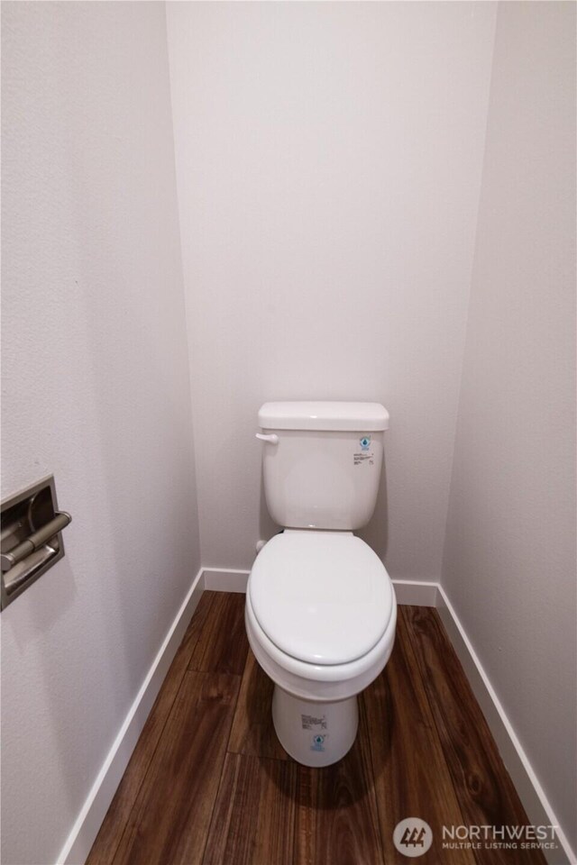 8570 Trillium Ln, Concrete, WA 98237 - bathroom featuring wood finished floors, baseboards, and toilet