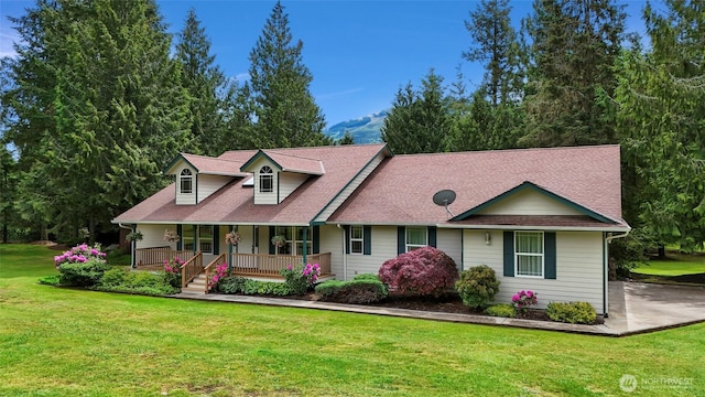 8368 Birdsview Meadows Ln, Concrete, WA 98237 - view of front of home with a porch, a front lawn, and roof with shingles