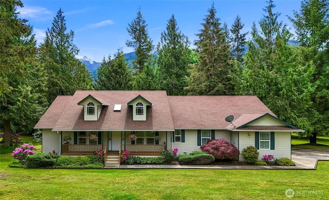 8368 Birdsview Meadows Ln, Concrete, WA 98237 - cape cod-style house with covered porch, a front yard, and roof with shingles