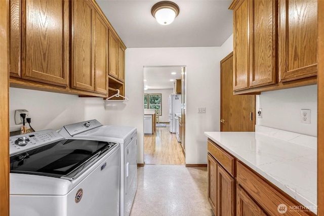 8368 Birdsview Meadows Ln, Concrete, WA 98237 - washroom featuring washing machine and dryer, cabinet space, and baseboards
