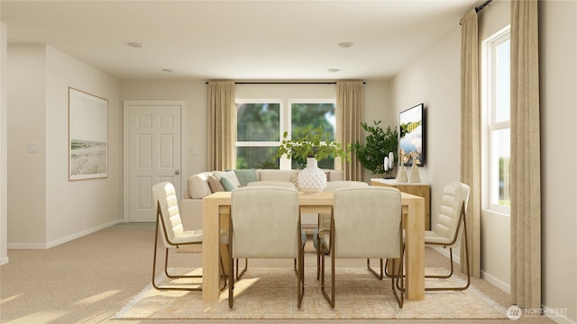 dining area with baseboards and light carpet