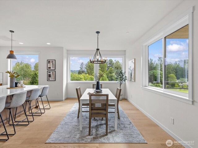667 17th Ave NW, Issaquah, WA 98027 - dining area with a chandelier, recessed lighting, baseboards, and light wood-type flooring