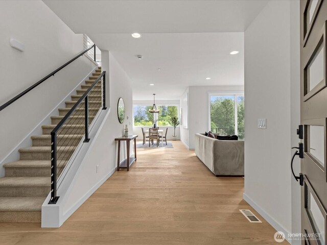 667 17th Ave NW, Issaquah, WA 98027 - foyer featuring stairs, baseboards, light wood-style flooring, recessed lighting, and a chandelier