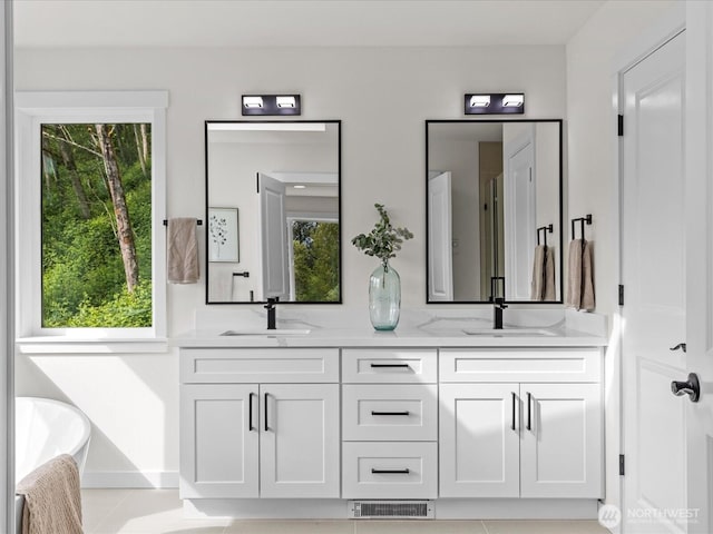 667 17th Ave NW, Issaquah, WA 98027 - bathroom featuring double vanity and a freestanding bath