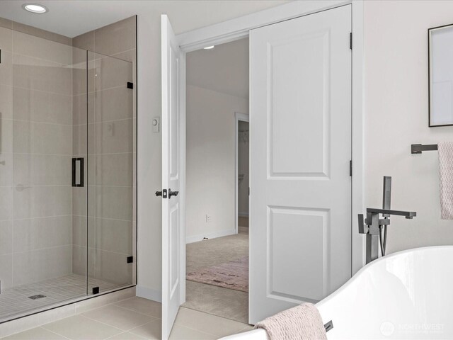 667 17th Ave NW, Issaquah, WA 98027 - full bathroom with a stall shower, a soaking tub, recessed lighting, tile patterned floors, and baseboards