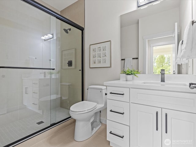 667 17th Ave NW, Issaquah, WA 98027 - full bathroom with toilet, a shower stall, vanity, and tile patterned flooring