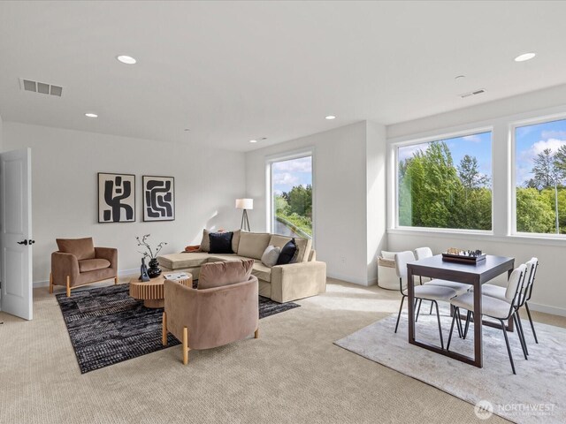 667 17th Ave NW, Issaquah, WA 98027 - living room featuring plenty of natural light, light carpet, recessed lighting, and baseboards