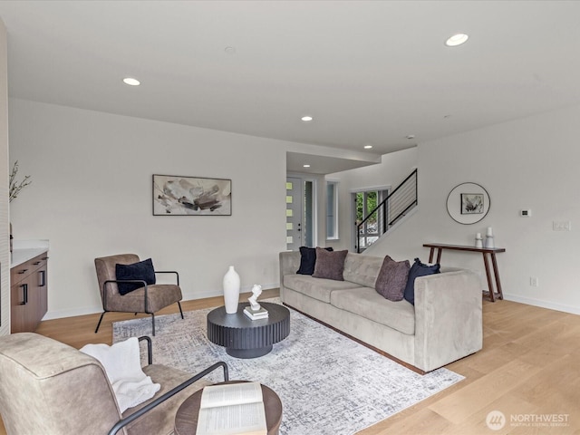 667 17th Ave NW, Issaquah, WA 98027 - living room featuring stairs, recessed lighting, light wood-style floors, and baseboards