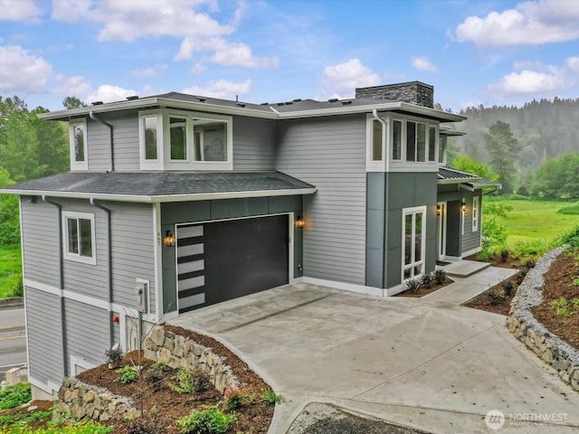667 17th Ave NW, Issaquah, WA 98027 - view of front of home with an attached garage, driveway, and a shingled roof
