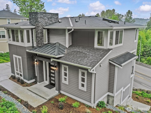 667 17th Ave NW, Issaquah, WA 98027 - rear view of property with a shingled roof