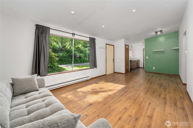 21813 223rd Pl SE, Maple Valley, WA 98038 - living area featuring a baseboard radiator, wood finished floors, and recessed lighting
