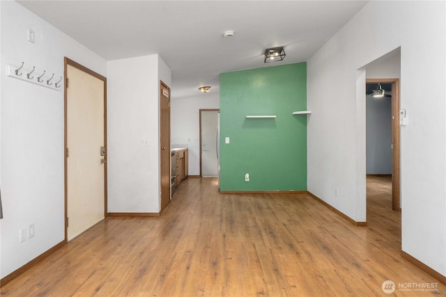 21813 223rd Pl SE, Maple Valley, WA 98038 - spare room featuring light wood-type flooring, a smoke detector, and baseboards