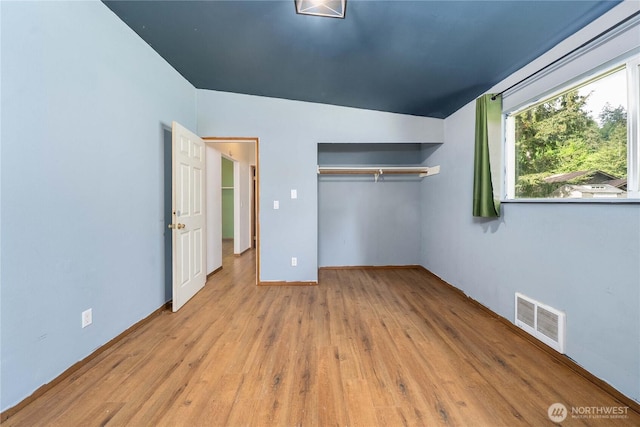 21813 223rd Pl SE, Maple Valley, WA 98038 - unfurnished bedroom featuring wood finished floors, a closet, and baseboards